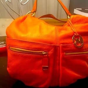 Michael Kors made orange color color